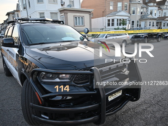 Police officers are blocking the area of the crime scene on Saturday morning. Three people are being shot in Paterson, New Jersey, United St...