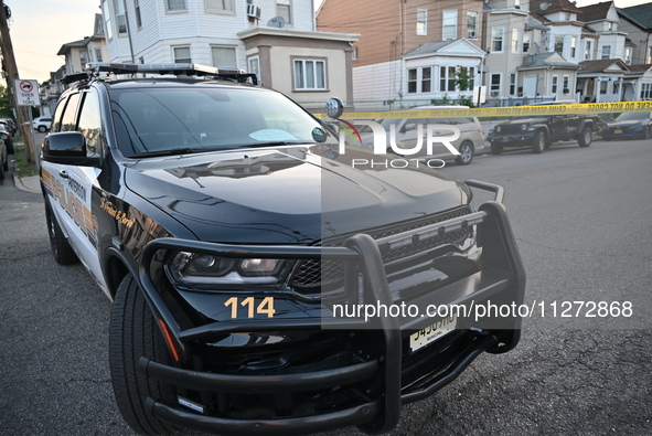 Police officers are blocking the area of the crime scene on Saturday morning. Three people are being shot in Paterson, New Jersey, United St...