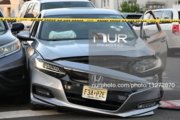 A vehicle is being damaged by bullet holes at the crime scene in Paterson, New Jersey, United States, on May 25, 2024. At approximately 1:50...