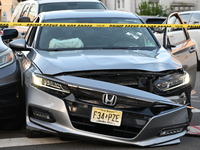 A vehicle is being damaged by bullet holes at the crime scene in Paterson, New Jersey, United States, on May 25, 2024. At approximately 1:50...