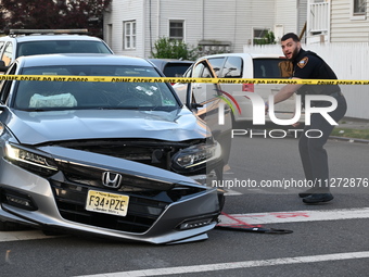 A vehicle is being damaged from bullet holes in the windshield at the crime scene on Saturday morning. Three people are being shot in Paters...