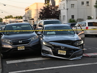 A vehicle is being damaged from bullet holes in the windshield at the crime scene on Saturday morning. Three people are being shot in Paters...