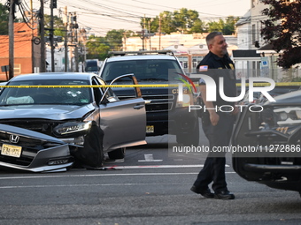 A vehicle is being damaged from bullet holes in the windshield at the crime scene on Saturday morning. Three people are being shot in Paters...