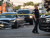 A vehicle is being damaged from bullet holes in the windshield at the crime scene on Saturday morning. Three people are being shot in Paters...