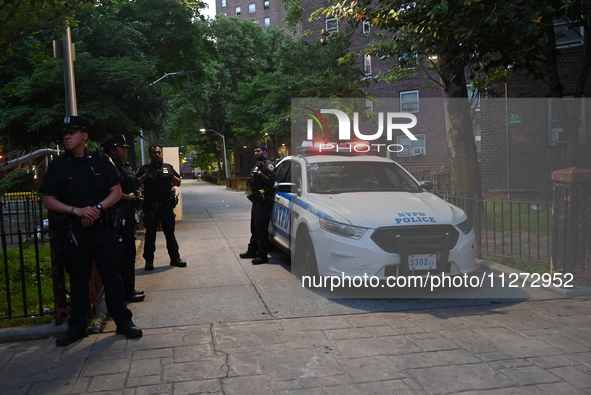 Police are present at the crime scene in Manhattan, New York, United States, on May 25, 2024. An unidentified male victim is being transport...