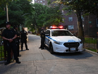 Police are present at the crime scene in Manhattan, New York, United States, on May 25, 2024. An unidentified male victim is being transport...