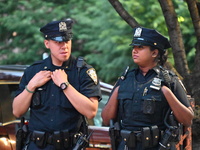 Police are present at the crime scene in Manhattan, New York, United States, on May 25, 2024. An unidentified male victim is being transport...