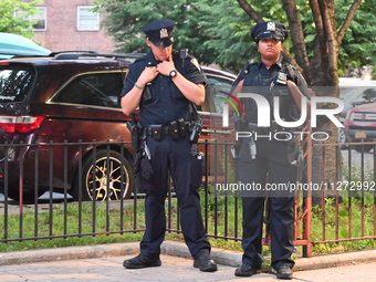 Police are present at the crime scene in Manhattan, New York, United States, on May 25, 2024. An unidentified male victim is being transport...