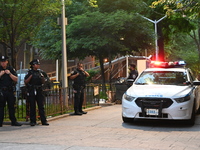 Police are present at the crime scene in Manhattan, New York, United States, on May 25, 2024. An unidentified male victim is being transport...