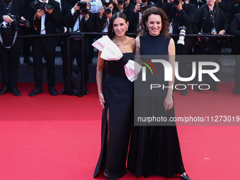 Demi Moore and Coralie Fargeat attend the Red Carpet of the closing ceremony at the 77th annual Cannes Film Festival at Palais des Festivals...