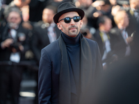 JR is attending the Red Carpet of the closing ceremony at the 77th annual Cannes Film Festival at Palais des Festivals in Cannes, France, on...