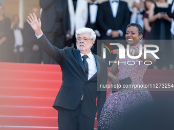 Mellody Hobson and George Lucas are attending the Red Carpet of the closing ceremony at the 77th annual Cannes Film Festival at Palais des F...