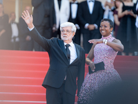 Mellody Hobson and George Lucas are attending the Red Carpet of the closing ceremony at the 77th annual Cannes Film Festival at Palais des F...