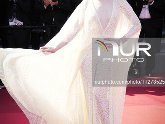 Elle Fanning is posing for a photo. during the Closing Ceremony at the 77th edition of the Cannes Film Festival in Cannes, southern France,...