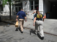 NYPD crime scene unit investigators are collecting evidence at the apartment building where the fatal stabbing took place. An unidentified m...