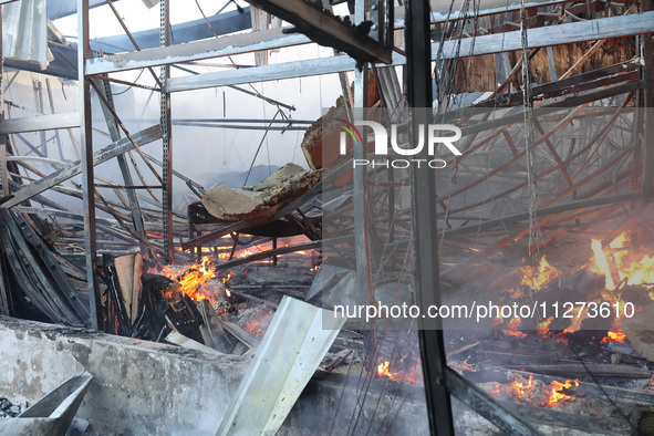 A fire is raging at an Epicentr K construction supermarket hit with two Russian glide bombs in Kharkiv, Ukraine, on May 25, 2024. At least f...