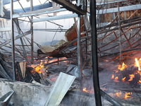 A fire is raging at an Epicentr K construction supermarket hit with two Russian glide bombs in Kharkiv, Ukraine, on May 25, 2024. At least f...