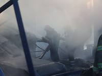 Rescuers are responding to a Russian glide bomb attack on an Epicentr K construction supermarket in Kharkiv, Ukraine, on May 25, 2024. At le...