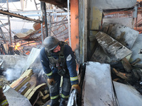 A rescuer is responding to a Russian glide bomb attack on an Epicentr K construction supermarket in Kharkiv, Ukraine, on May 25, 2024. At le...