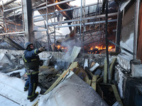 A rescuer is responding to a Russian glide bomb attack on an Epicentr K construction supermarket in Kharkiv, Ukraine, on May 25, 2024. At le...