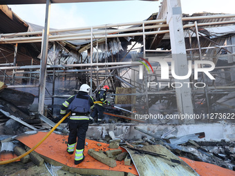 Rescuers are responding to a Russian glide bomb attack on an Epicentr K construction supermarket in Kharkiv, Ukraine, on May 25, 2024. At le...