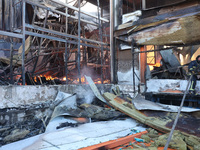 A rescuer is responding to a Russian glide bomb attack on an Epicentr K construction supermarket in Kharkiv, Ukraine, on May 25, 2024. At le...