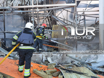 Rescuers are responding to a Russian glide bomb attack on an Epicentr K construction supermarket in Kharkiv, Ukraine, on May 25, 2024. At le...