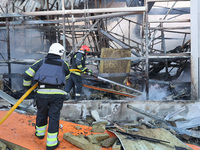 Rescuers are responding to a Russian glide bomb attack on an Epicentr K construction supermarket in Kharkiv, Ukraine, on May 25, 2024. At le...