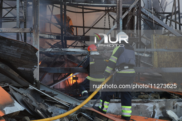 Rescuers are responding to a Russian glide bomb attack on an Epicentr K construction supermarket in Kharkiv, Ukraine, on May 25, 2024. At le...