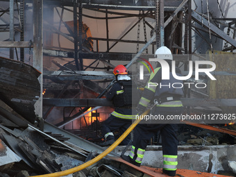 Rescuers are responding to a Russian glide bomb attack on an Epicentr K construction supermarket in Kharkiv, Ukraine, on May 25, 2024. At le...