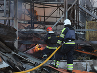 Rescuers are responding to a Russian glide bomb attack on an Epicentr K construction supermarket in Kharkiv, Ukraine, on May 25, 2024. At le...