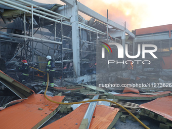 Rescuers are responding to a Russian glide bomb attack on an Epicentr K construction supermarket in Kharkiv, Ukraine, on May 25, 2024. At le...