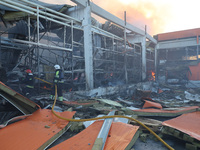 Rescuers are responding to a Russian glide bomb attack on an Epicentr K construction supermarket in Kharkiv, Ukraine, on May 25, 2024. At le...