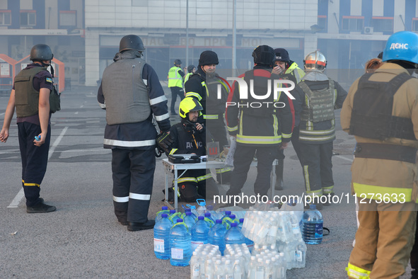 Rescuers are gathering outside an Epicentr K construction supermarket hit with two Russian glide bombs in Kharkiv, Ukraine, on May 25, 2024....