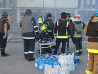 Rescuers are gathering outside an Epicentr K construction supermarket hit with two Russian glide bombs in Kharkiv, Ukraine, on May 25, 2024....