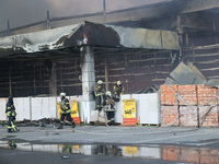 Rescuers are responding to a Russian glide bomb attack on an Epicentr K construction supermarket in Kharkiv, Ukraine, on May 25, 2024. At le...