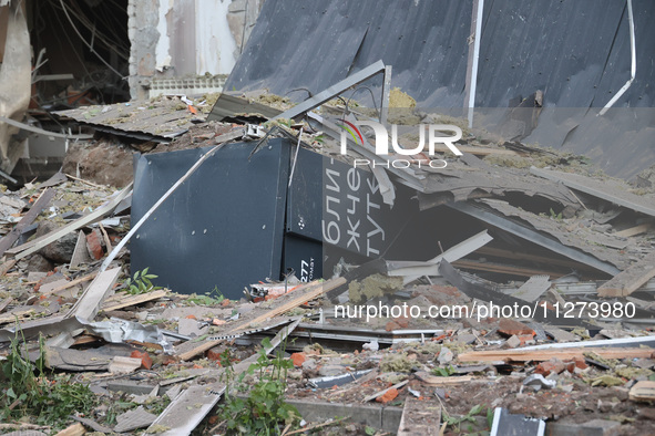 A parcel locker is being seen among the debris at an office building destroyed by a Russian missile strike in central Kharkiv, Ukraine, on M...