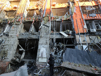 A police officer is exploring the premises of an office building destroyed by a Russian missile strike in central Kharkiv, Ukraine, on May 2...