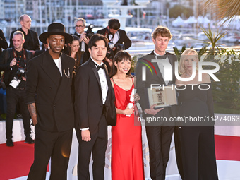Chiang Wei Liang and You Qiao Yin are posing with the 'Special Mention Camera d'Or' Award for 'Mongrel', and Halfdan Ullmann Tondel is posin...
