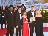 Chiang Wei Liang and You Qiao Yin are posing with the 'Special Mention Camera d'Or' Award for 'Mongrel', and Halfdan Ullmann Tondel is posin...