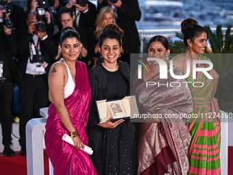 Kani Kusruti, Chhaya Kadam, Payal Kapadia, and Divya Prabha are posing with the Grand Prix Award for 'All We Imagine As Light' at the Palme...