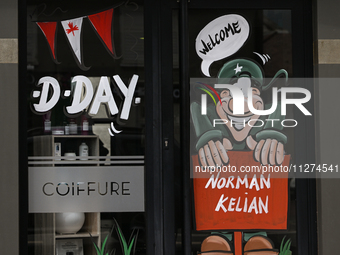 CARPIQUET, FRANCE - MAY 24: 
A D-Day related images painted in a local businesses windows, on May 24, 2024, in Carpiquet, Caen, France (
