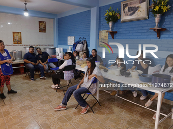 Inhabitants of Culhuacan in the extreme south of Mexico City are gathering for a meal before a procession to the Sanctuary of the Lord of Ca...