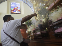 An inhabitant of Culhuacan in the extreme south of Mexico City is attending a mass at the Sanctuary of the Lord of Calvary on the eve of the...