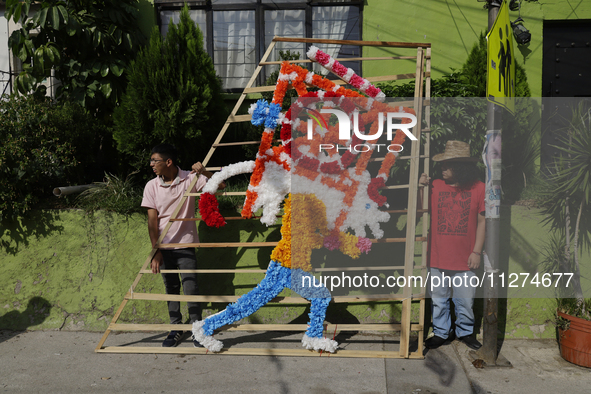 Inhabitants of Culhuacan in the extreme south of Mexico City are carrying a portada during a procession to the Sanctuary of the Lord of Calv...