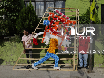 Inhabitants of Culhuacan in the extreme south of Mexico City are carrying a portada during a procession to the Sanctuary of the Lord of Calv...