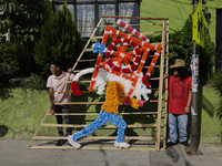 Inhabitants of Culhuacan in the extreme south of Mexico City are carrying a portada during a procession to the Sanctuary of the Lord of Calv...