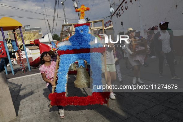 Inhabitants of Culhuacan in the extreme south of Mexico City are carrying a portada during a procession to the Sanctuary of the Lord of Calv...