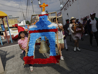 Inhabitants of Culhuacan in the extreme south of Mexico City are carrying a portada during a procession to the Sanctuary of the Lord of Calv...