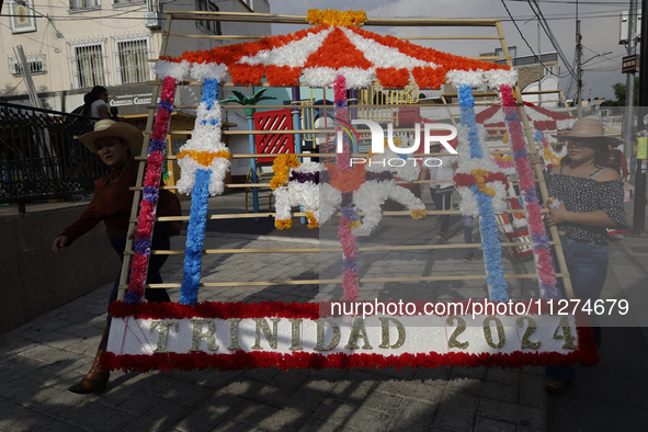 Inhabitants of Culhuacan in the extreme south of Mexico City are carrying a portada during a procession to the Sanctuary of the Lord of Calv...